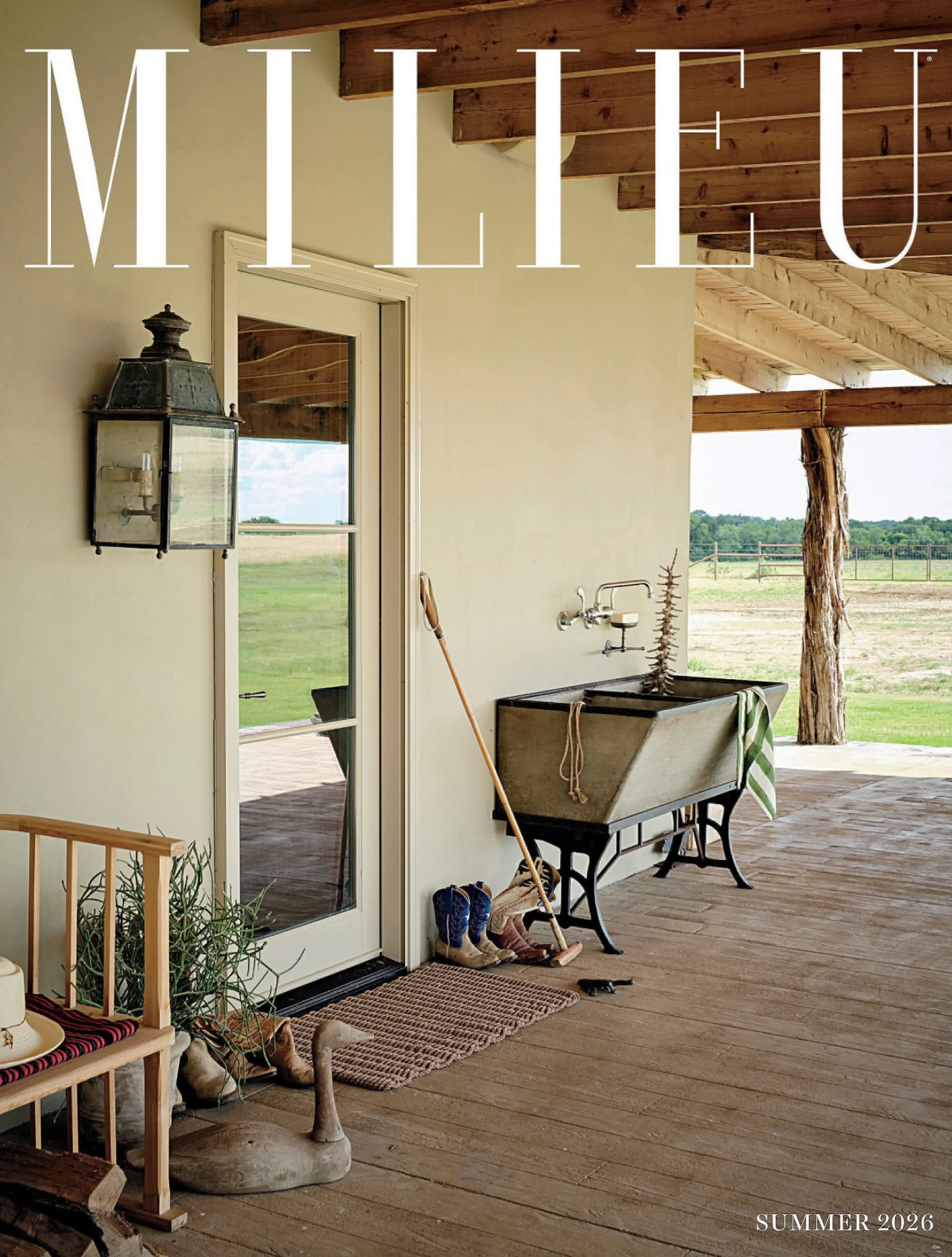 Outdoor rustic porch with sink and seating, summer 2026 at Melissa Lacy Design.